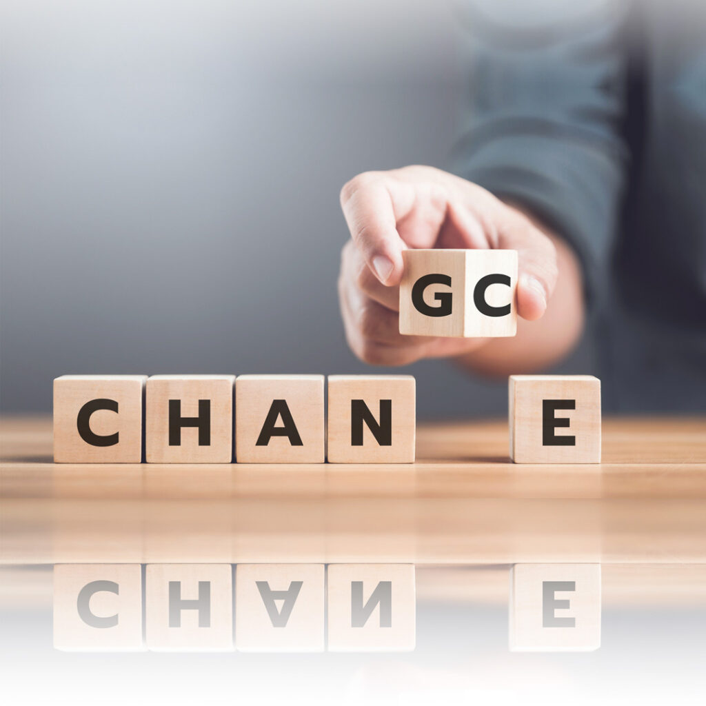 A man selects between the words 'CHANGE' and 'CHANCE' on wooden blocks, symbolizing the decision-making process and embracing opportunities for growth