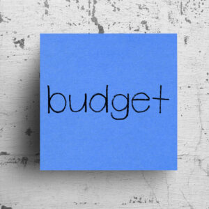 Sticky note on concrete wall, Budget